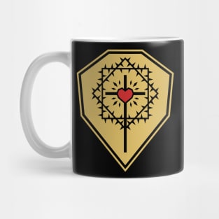 The cross of Jesus Christ with a heart framed by a crown of thorns against the background of a shield. Mug